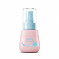 Pink baby cologne bottle with blue spray nozzle on a white background