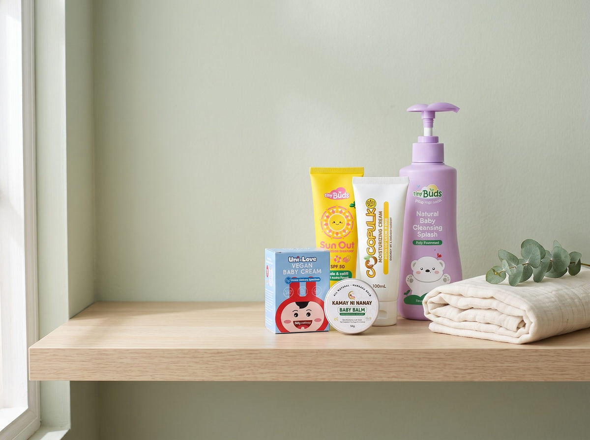 Tiny Buds, Cocopulko, Kamay ni Nanay and Uni-Love baby care products on a sunlit nursery shelf